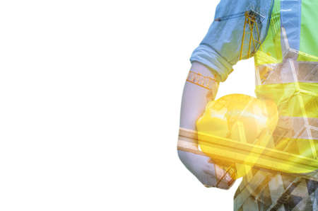 Double exposure of Engineer with safety helmet with construction site with crane and building,business backgroundの写真素材