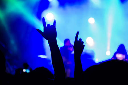 BANGKOK, THAILAND - MAY 5 :Crowd at concert - silhouettes of concert crowd in front of bright stage lightsのeditorial素材