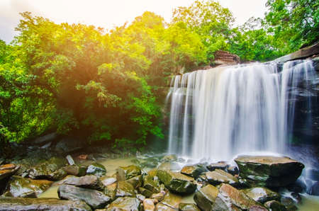 Tung Na Muang waterfall, The beautiful waterfall in deep forest during raining season at Tung Na Muang Park, Ubon Ratchathani province, Thailand.の写真素材