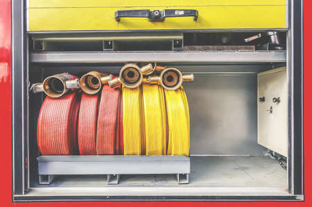 Firefighters tools fire extinguisher and hose, accessories and equipment for fire fighting in the...