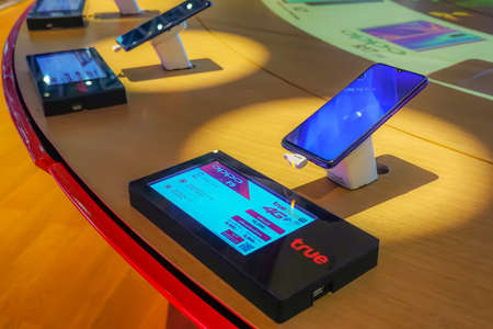 BANGKOK,THAILAND - APRIL 7, 2019: Showcase with smartphones in the TRUE modern electronics store....
