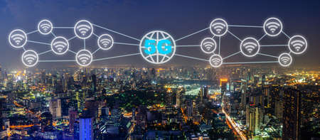 Communication network concept 5G and internet of things with smart city on night background. Modern...