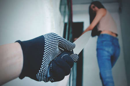 Unknown criminal guy with knife following young girl on the stair she was walking  to room, Robbery...