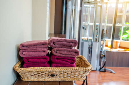 Close Up of clean towels in basket at fitness room, ready to use.の写真素材