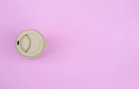 Top view image of coffee paper cup on pink pastel background. Copy spaceの写真素材