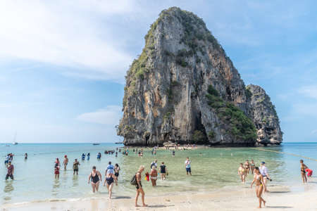 Krabi, Thailand - February 15, 2020: Tropical holidays - Tourists and turquoise crystal clear sea water with Stunning view of Railay Beach with limestone rock in Krabi, Thailandのeditorial素材