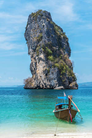 Thai traditional wooden longtail boat and beautiful sand beach at Koh Poda island in Krabi province.  Ao Nang, Thailand ,Krabi island is a most popular tourist destination in Thailandのeditorial素材