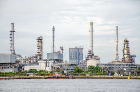Oil refinery plant of Petrochemistry industry in sunset time, gas and oil production processing in Bangkok, Thailand.のeditorial素材