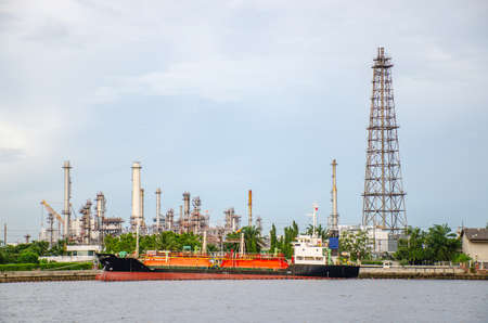 Oil refinery plant of Petrochemistry industry in sunset time, gas and oil production processing in Bangkok, Thailand.のeditorial素材