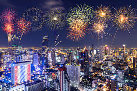 New Year colorful fireworks with cityscape bangkok skyline in night time, Many hotel, temple and height building for business stand in the heart of Bangkok,Thailand.の写真素材