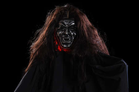 Portrait of devil mask for halloween on a black backgroundの写真素材