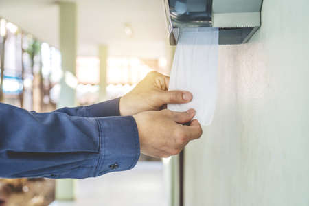 Hand Using Toilet Paper out toilet. diarrhea constipation.Health conceptの写真素材