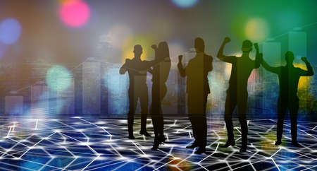 Silhouettes of Happy young business people joy standing over skyscraper background with double exposure of graphs. Concept of business success, Concept of trading and financial analysisの写真素材