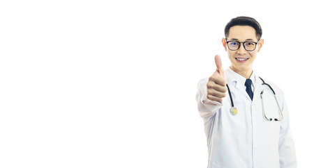 Asian good doctor man smile and thumbs up for best health and insurance package plan for advertising, over isolated white backgroundの写真素材