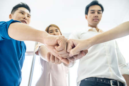 Teamwork business join hand together concept, Image of hands in circle as symbol of their partnership and teamwork,we will do the best concept, Volunteer charity work. People joining for cooperation success business.の写真素材