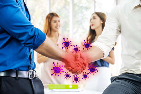 Hand shake warning, Coronavirus or COVID-19 attack concept, the most transmission of virus or bacteria from hand touch or Hand shaking concept , danger and public health risk diseaseの写真素材