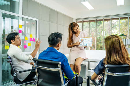 Businesswoman standing and leading business presentation. Female executive putting his ideas during...