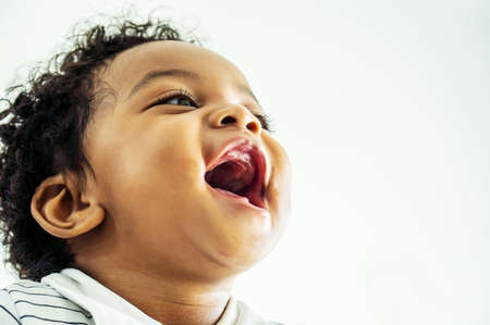 Funny and happy african american cute baby boyの写真素材