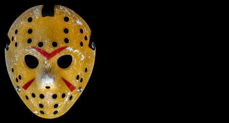 Bloody hockey mask worn by slasher Jason Voorhees from the Friday the 13th movie franchise on the black background. Looks awesome on Halloween.のeditorial素材