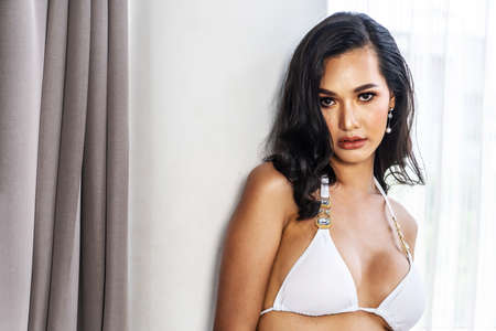 Beautiful portrait young asian woman sexy wear white bra, She was looking at the camera smiling, body of girl happy with freshness and cheerful with wellbeing, lifestyle and relax concept.の写真素材