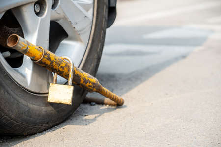 Car wheel was locked by wheel because of the wrong parking, overnight parking, âWhere parking is prohibited In the mall.の写真素材