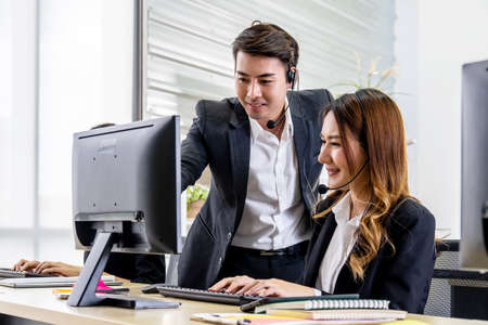Customer service executive trainer assisting her team at office, Business Team Discussion Team Customer Service Concept, Selective focus is manの写真素材