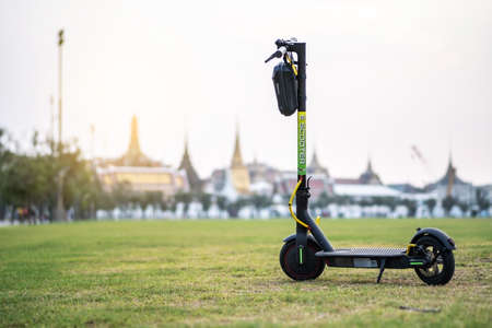 e-scooter parked in front of Wat Phra Kaew temple of the emerald buddha.の写真素材