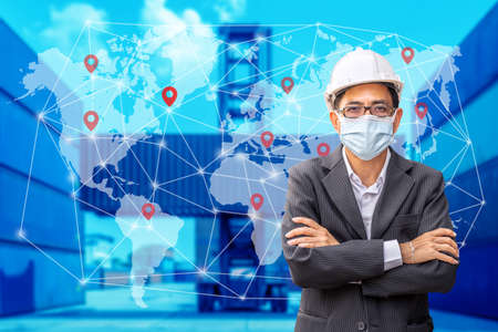 Male engineer or manager to control container load in industrial transport concepts, Map global logistics partnership connection of Container Cargo freight ship for Import Export backgroundの写真素材