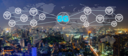Communication network concept 5G and internet of things with smart city on night background. Modern city with wireless network connection concept, 5G network interface and wifi icon conceptの写真素材