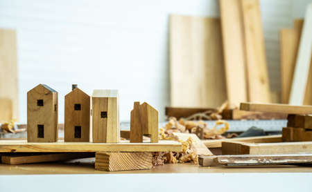 DIY project at home concept, House made of wood with craft tools on workbench.Table for making handmade wood work at carpenter's home.の写真素材