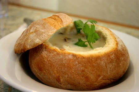 Seafood chowder soup in a bread bowlの写真素材