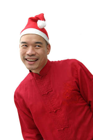 Chinese man in a red Chinese top and Santa hatの写真素材