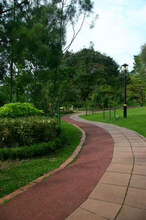 A public park in Kuala Lumpur with artificial stone paveway leading away
