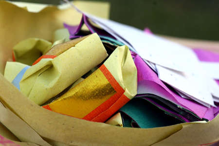 Folded paper offerings for Ching Ming festival at a Chinese cemeteryの写真素材