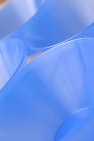 Blue conical plastic bowls laid outの写真素材