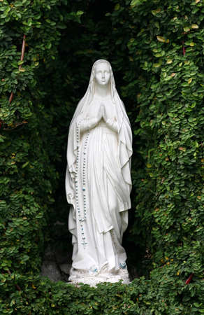 Statue or figurine of Mother Mary at grottoの写真素材