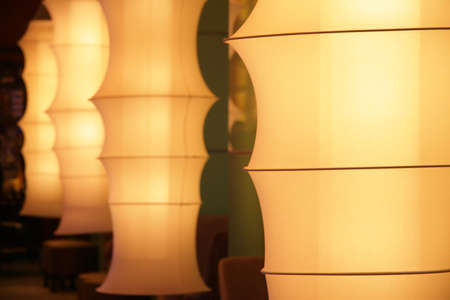Fashionable fabric tubed lamps at a bar loungeの写真素材