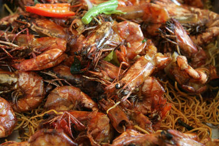Large tiger prawns cooked in a dry assam jawa styleの写真素材