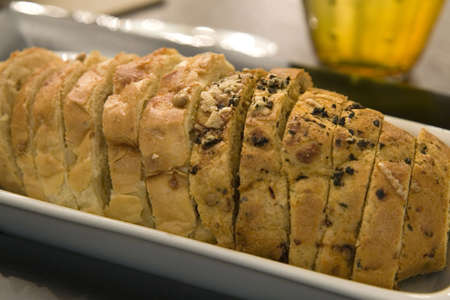 Freshly baked wheat germ bread served with variety of butter