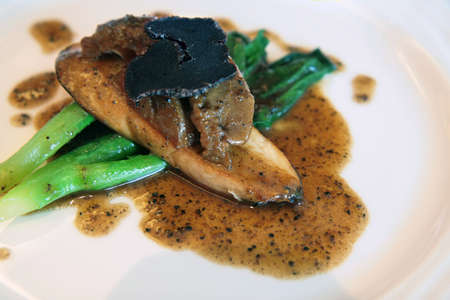 Abalone with mushroom and truffle on Chinese vegetables