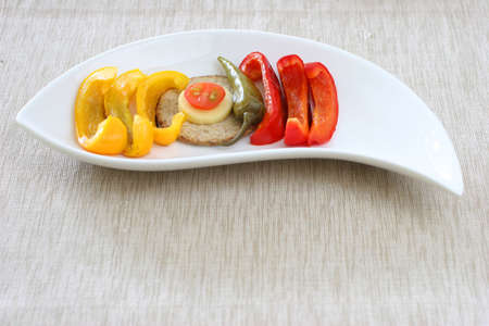 Healthy colorful platter with assorted vegetables on fancy white chinaの写真素材