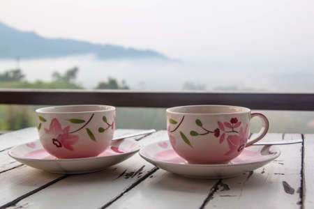 Twin coffee cup on tableの写真素材