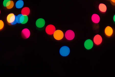 The colorful lights on black backgroundの写真素材