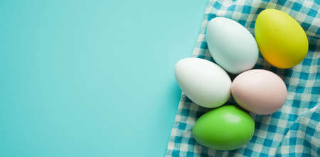 Colorful easter eggs on blue background. Happy easter concept.