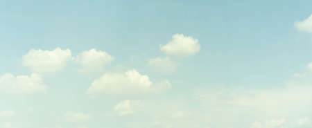 Blue sky background with tiny clouds. Panoramic image of blue sky.