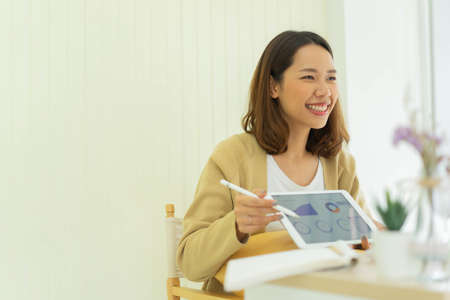 close up young asian employee woman video conference with marketing and sale team to showing and...