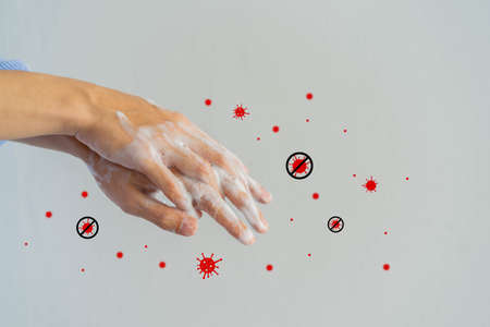 close up adult man washing and rubbing hand to cleaning soap with spreading virus and droplet icon for protection and prevent coronavirus (MERS-nCOV) and bacteria conceptの写真素材
