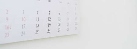 close up on calendar 2021 month schedule on white wall n office room to make appointment meeting or manage timetable each day for planning work and life conceptの写真素材