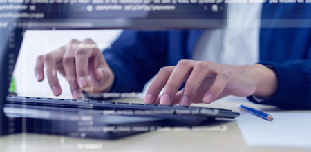 close up programmer man hand typing on keyboard at computer desktop for input coding language to...