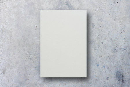 Blank white paper on concrete background, top view. Space for text